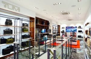 Recessed lighting brightens a handbag retail space and enhances product displays.