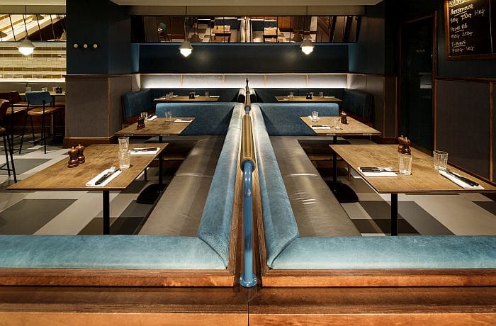 Restaurant booth seating with integrated LED wall lighting
